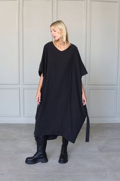 Black Relaxed Fit V-neck Maxi Dress, Oversized Tunic Midi Dress, Black Lagenlook Tunic Dress, Black Relaxed Fit Tunic Dress, Relaxed Fit V-neck Lagenlook Dress, Flowy V-neck Lagenlook Dress, Black Oversized Lagenlook Dress, Oversized Black Tunic, Black Oversized Dress With Asymmetrical Hem