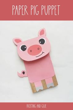 a pink paper pig puppet sitting on top of a piece of cardboard with the words, how to make a paper pig puppet