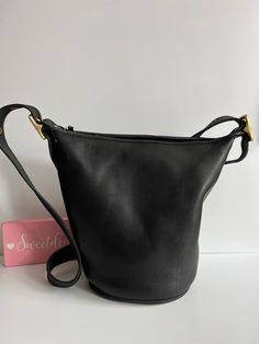 Vtg Coach Original  Helen's Legacy Duffle Bag Black leather with brass hardware Roomy interior with slip pocket Secured with a top zipper Detachable, adjustable 48" strap Measures: 11"H, 12.5"L, 7"W Made in Turkey #H6I-9953 Cleaned, conditioned and ready to wear! Questions? Just ask More vtg coach styles/colors also available g90 Classic Bucket Shoulder Bag With Gold-tone Hardware, Classic Bucket-shape Shoulder Bag With Detachable Strap, Classic Hobo Shoulder Bag With Snap Closure, Formal Bucket Bag With Brass Hardware, Travel Bucket Bag With Brass Hardware, Classic Bucket Satchel With Adjustable Strap, Classic Leather Bucket Bag With Gold-tone Hardware, Classic Black Bucket Shoulder Bag, Classic Bucket Hobo Bag For Formal Occasions