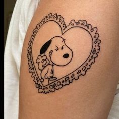 a heart shaped tattoo with a dog on it