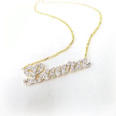 "Our Cutoff Date for Christmas delivery is Sunday Dec. 13, 2020 All Order placed after this date will be completed for mid January delivery. Personalized gold and diamond name necklace 1.25\" wide and about 1mm thick, made of solid 14k Yellow gold and Diamonds. The necklace suspends from a cable Link chain with 3 choices of length: 14\",16\", 18\" and 20\". The necklace can be made with the name of your choice up to 7 letters. A Great gift for Christmas Valentines, Birthday, Anniversary or any o Luxury Diamond Pendant Name Necklace, Fine Jewelry Name Necklace With Diamond Accents, Luxury Diamond Name Necklace As Gift, White Gold Diamond Name Necklace Gift, Fine Jewelry Custom Name Necklace In White Gold, Luxury Nameplate Necklace With Diamond Accents, White Diamond Nameplate Jewelry, Diamond Name Necklace In White Gold For Gift, White Gold Diamond Name Necklace As Gift