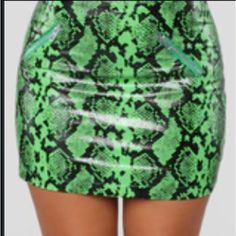 Nwt! Sexy Hot Lime Green And Black Print Mini Skirt With 2 Zippered Pockets And Lining . High Waist Fitted Leather Feel 45% Viscose & 55% Pu. The Lining Is 100% Polyester Print Mini Skirt, Green And Black, Black Print, Lime Green, Fashion Nova, Mini Skirt, High Waist, Womens Skirt, Mini Skirts