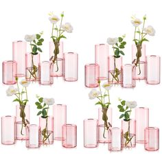 several pink vases with white flowers in them