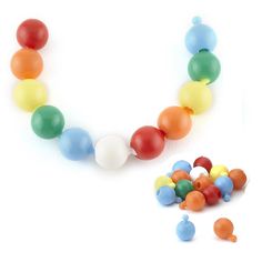 there is a necklace made out of plastic balls on the white background with other beads