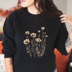 Introducing our delightful floral sweater, the perfect blend of style and comfort. Made from high-quality, soft materials, this sweater features a stunning floral design that adds a touch of elegance to any outfit. Whether you dress it up with a skirt or pair it with jeans for a casual day out, this versatile sweater will keep you cozy and chic all year long. With its flattering fit and eye-catching pattern, it's sure to become a favorite in your wardrobe. Step into the season with confidence and make a statement with our beautiful floral sweater. .: 50% cotton, 50% polyester .: Medium-heavy fabric (8.0 oz/yd² (271.25 g/m .: Loose fit .: Sewn-in label .: Runs true to size Fall Cotton Sweater With Floral Print, Fall Cotton Floral Print Sweater, Cotton Floral Print Fall Sweater, Cotton Floral Print Sweater For Fall, Cotton Floral Print Long Sleeve Sweater, Floral Print Long Sleeve Sweatshirt For Fall, Fall Floral Print Crew Neck Sweater, Cotton Floral Print Sweatshirt For Fall, Floral Print Crew Neck Sweater For Fall