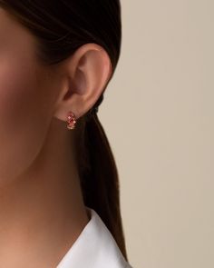 Handcrafted from 14-karat gold, these hoops are set with a stunning array of multi-cut pink ombre gemstones, creating a vibrant spectrum of color that adds a dynamic touch to any outfit. Perfect for both day and evening wear, these earrings bring a splash of color and sophistication to your look. Details 14k rose gold 3x3mm princess-cut pink topaz and morganite topaz 4x2mm baguette-cut pink topaz 4x4mm clover-cut salmon topaz 0.10 carats of round white diamonds 12mm hoops Ref: PE700A Modern Pink Small Hoop Earrings, Modern Pink Small Hoop Jewelry, Luxury Pink Hoop Earrings, Pink Formal Hoop Earrings In Fine Jewelry Style, Pink Hoop Earrings For Formal Occasions, Elegant Multicolor Huggie Earrings, Elegant Pink Hoop Earrings, Pink Huggie Hoop Earrings Fine Jewelry, Elegant Multicolor Huggie Jewelry