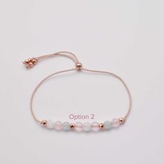 Our handmade adjustable fertility bracelet features a natural silk chord, and high-grade 4mm fertility crystals such as rose quartz, aquamarine, moonstone, and rose gold hematite accents. It is infused with Reiki Healing energy for positive support. Perfect for a mama-to-be or women who are undergoing IVF treatments, providing the right energy to help them during their treatment. **Crystal Properties:**✨ **"Rose Quartz is a gentle stone known for promoting unconditional love, healing emotional w Fertility Crystals, Fertility Bracelet, Crystal Properties, Moonstone Crystal, Kids Necklace, Healing Energy, Dainty Bracelets, Natural Silk, Reiki Healing