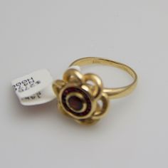 "For sale: (1) d528 14k Yellow Gold Red Stone Flower Ring PLEASE READ ENTIRE DESCRIPTION BEFORE PURCHASING Pre-owned item. Good condition. Please see pictures for details. Sold as is, as seen on pictures. This yellow gold ring is absolutely stunning. It contains eleven (11) beautiful red stones. This ring is stamped. Specifics: 14k Yellow gold Size: 4.5 (U.S.) Ring Dimensions: 12.5 mm x 15 mm Stone Dimensions: 3 mm round Total Weight: 4.7 grams Please be 100% sure of your purchase before buying, Eleven 11, S Ring, Red Stones, Sterling Silver Chain Necklace, Red Band, Filigree Ring, Red Stone, Yellow Gold Ring, Silver Chain Necklace