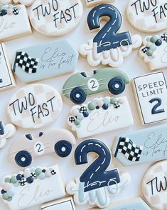 decorated cookies with numbers and race cars on them for two fast, two fast birthdays