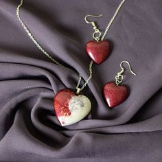 Two-Toned Heart Earring and Pendant Set...Silver plated.  Pendant is Two-Toned White & Burgundy, Earrings are a matching Burgundy ONLY 1 Unique set like this! Nickel-free Heart Pendant Earrings For Gift, Heart Beads Pendant Earrings As A Gift, Heart Pendant Earrings With Heart Beads For Gift, Heart-shaped Jewelry For Gifts, Valentine's Day Heart Pendant Earrings Gift, Gift Heart Earrings With Heart Cut And Beads, Gift Heart-shaped Beaded Earrings, Heart Cut Beaded Earrings As Gift, Heart Cut Earrings With Heart Beads For Gift