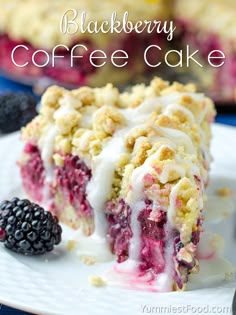 blackberry coffee cake on a white plate with blackberries