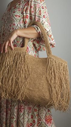 Large natural Beige Crochet Raffia Shopper bag with tassels,Shoulder Bag for the Beach or as a Chic Market bag in🌴🛍️ This listing is for pre-order. The colors I am currently posting are in the production process, and the bags will be shipped within 2 weeks. Please consider this when making your purchase. Thank you very much.🫠 This spacious bag crafted from raffia can accommodate all your essentials and doubles as a chic beach tote. Fully lined with a zippered pocket inside for storing your valuables, it offers both practicality and style. Fold the sides inward to transform it into a triangular shape for a smaller carrying option. Being made from raffia, it's incredibly lightweight and easy to clean with a damp cloth. Elevate your look with this versatile piece that combines functionalit Bag For The Beach, Accessory Inspo, Beige Crochet, Macrame Bag, Beach Tote, Market Bag, Shopper Bag, Bag Shoulder, Production Process