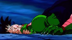 a cartoon character laying on the ground with his head in another person's hand