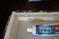 a tube of toothpaste sitting in a box