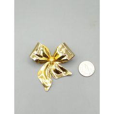 "Vintage TONA Gold Tone Bow Brooch, Large Christmas Ribbon with CZ Accents, Old Fashioned Lapel Pin Measurement * 2-1/2\" x 2-1/2\" Condition * Very nice condition. Gently worn with minimal wear. SIZE: Unisex OS CONDITION: Pre-Owned Good Very nice condition. Gently worn with minimal wear." Elegant Gold Brooches For Christmas, Elegant Gold Christmas Brooches, Gold Brooch With Decorative Bow For Party, Gold Holiday Brooch Jewelry, Gold Christmas Brooches For Festive Occasion, Gold Lapel Pin For Party, Gold Brooch With Decorative Bow As Gift, Gold Brooches With Decorative Bow For Gift, Gold Christmas Brooches For Formal Wear