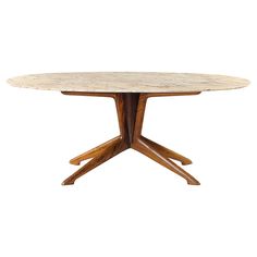 a round wooden table with four legs and a marble top on an isolated white background