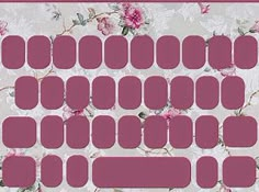 a computer keyboard with pink flowers on the back and white letters that spell it out