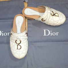 Authentic Vintage Dior Girl Clogs Patent Cannage Dbuckle Detail 30size Made In Italy. White Creme Color Patent Leather Dbuckle Detail Cannage Stitching. Production 2005-2010 Year Comes With Original Box, Dust Bags. Condition Preowned - Marks & Scratches Throughout Patent Leather And Hardware Due To Aging. Hills Have Dings From Normal Wear. Worn Very Few Times, In Storage Past 10 Years. Very Pretty Clogs, Beautiful And Comfortable To Wear. Vintage Clogs, Girls Clogs, Dior Girl, Creme Color, Girl Vintage, Dior Shoes, Vintage Dior, Flip Flop Sandals, Patent Leather