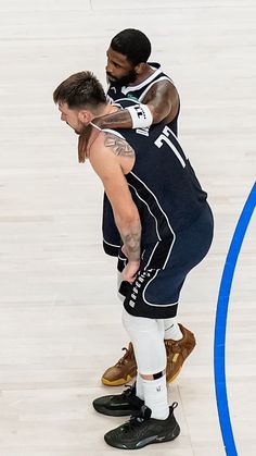 NBA basketball wallpaper background of Dallas Mavericks stars Luka Doncic and Kyrie Irving embracing on the court Basketball Background, Love Is Real, Western Conference