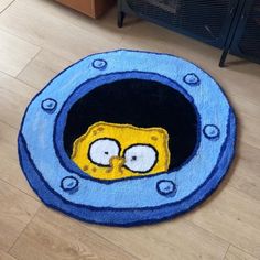 the rug is made to look like it has an image of homer from the simpsons