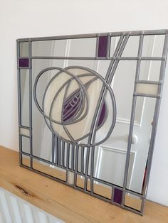 a mirror that is sitting on top of a shelf