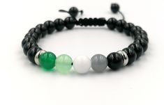 Aromatic Pride Bracelet! A handcrafted bracelet made with colorful Jade stones, stainless steel rings and Black Onyx stones, in a black cord. This bracelet is the perfect aromatic jewelry gift. Love is Love! Share it with LGBTQ+ ! - Jade stones 8mm - Black Onyx stones 8mm - Stainless Steel beads 8mm - Comes in a cute little organza bag! - If you prefer a gift box, ready for gift giving, please browse here: https://www.etsy.com/listing/248159830/cute-gift-box?ref=shop_home_active_67 - Browse my s Modern Handmade Black Bracelets, Modern Black Bracelet As A Gift, Modern Black Bracelets For Friendship, Handmade Black Crystal Bracelet As Gift, Handmade Black Crystal Bracelet Gift, Adjustable Onyx Bracelet Gift, Casual Black Jewelry For Healing, Modern Adjustable Onyx Beaded Bracelets, Adjustable Onyx Crystal Bracelet With Natural Stones