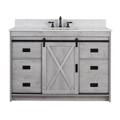 a bathroom vanity with two sinks and an open barn door on the front, white marble counter top