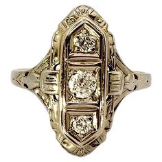 A stunning Art Deco design ring in 18kt white gold and brilliant-cut Diamonds. This ring has an ogive shape and is embellished with three brilliant-cut Diamonds set vertically at the top. The central Diamond has a larger size than the other two. The weight of the center stone is about 0.15 carat while the two beside it weigh about 0.10 carat each. The entire top surface of the ring has delicate fretwork and engraving, made by hand. The weight is 3.20 grams. Its size is 6.25 ( 53 EU ) and can be Art Nouveau Engagement Ring, Engagement Rings Romantic, Contemporary Engagement Rings, Gold Art Deco, Deco Ring, Gold Art, Art Deco Ring, Love Ring, Art Deco Design