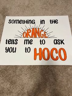 a sign that says something in the orange tells me to ask you to hoco