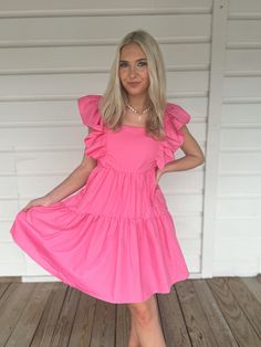 Adorable flowy pink babydoll dress with ruffle sleeves. Model is 5'4" with a 25" waist, 32" bust, and 32" hips wearing a small. Pink Flirty Ruffle Dress For Day Out, Flirty Pink Ruffle Dress For Spring, Pink Flowy Tiered Dress With Ruffles, Flirty Pink Ruffle Dress For Day Out, Flowy Pink Tiered Dress With Ruffles, Pink Mini Tiered Ruffled Dress, Pink Ruffled Mini Length Tiered Dress, Pink Flirty Mini Ruffle Dress, Pink Mini Tiered Dress With Ruffled Skirt