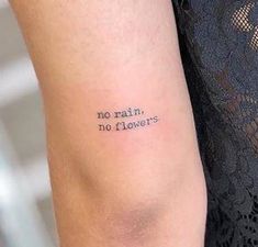 a woman's arm with a tattoo saying no rain, no flowers