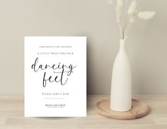 a card with the words dancing feet on it next to a vase filled with flowers