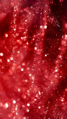 an abstract red and pink background with lots of small bubbles on it's surface