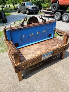 a blue truck bed sitting on top of a wooden bench