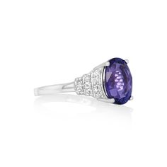 This exquisite 3.6 Cts Tanzanite and White Diamond Ring in 14K White Gold is a true gem. With its stunning design and high-quality materials, it exudes elegance and sophistication. The 0.29 Cts White Diamond and 4.3Grams Metal add a touch of luxury, making it a valuable addition to any jewelry collection. Elegant Sapphire Ring With Vvs Clarity Cushion Cut, Elegant Cushion Cut Gemstone With Center Stone, Elegant Cushion Cut Gemstones, Elegant Oval Tanzanite Gemstones, Luxury Tanzanite Ring With Center Stone, Elegant Oval Tanzanite Rings, Elegant Tanzanite Diamond Ring With Brilliant Cut, Elegant Sapphire Ring With Tanzanite And Polished Finish, Elegant Tanzanite Diamond Ring With Prong Setting