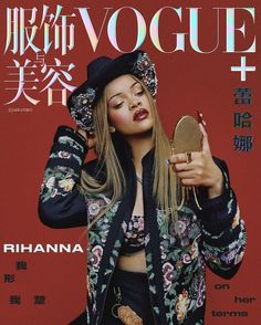 a magazine cover with a woman holding a mirror in front of her face and wearing a hat