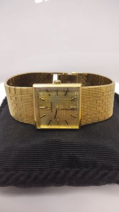 "For Sale: (1) k636 Stunning Unisex 18kt Yellow Gold Mechanical Omega Wristwatch                             PLEASE READ ENTIRE DESCRIPTION BEFORE PURCHASING This is a stunning 18kt yellow gold Omega wristwatch from roughly the 1970s.  Mechanical movement. Solid gold case and band. Stamped 750 on its clasp.  Would be a nice anniversary, birthday, Christmas, Father's Day, Mother's Day or Valentine's Day gift for him or her!  Specifics: Omega Mechanical Wristwatch 18kt Yellow Gold Case width: 22.5mm without crown Case thickness: 6.3mm Band width: Tapers from 19mm down to 15mm Band length: 7.5\" Weight: 69.4 g ------------------------------------------------------------------------------------------------------------------------------------------------ Please be 100% sure of your purchase bef Floral Wedding Bands, Yellow Gold Jewelry, Star Sapphire, Valentines Day Gifts For Him, Star Ruby, Mechanical Movement, Rose Gold Jewelry, Gold Case, Wrist Watches