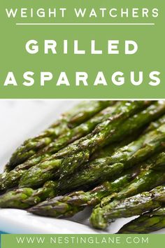 grilled asparagus on a white plate with text overlay reading weight watchers grilled asparagus