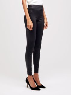 A super skinny pull-on jean with a sophisticated sheen. Minimalistic design is pocketless and features a wide elastic waistband for a completely smooth silhouette. Crafted from premium denim infused with luxe modal, Rochelle feels soft and comfortable while retaining a sleek shape that hugs from hip to ankle. Elegant High Rise Jeans, Modern Stretch Bottoms For Evening, Chic Stretch Jeans For Business Casual, Sleek High-rise Leggings For Work, Sleek High Rise Leggings For Work, Elegant Minimal Stretch Mid-rise Bottoms, Elegant Stretch Jeans For Business Casual, Elegant Micro-elastic Bottoms For Night Out, Chic Straight Leg Pull-on Leggings