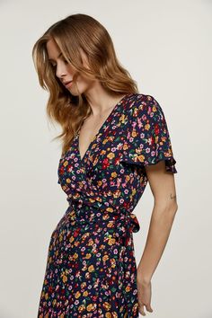 This summer wrap dress is crafted in woven floral print fabric.  It has a V neckline and short ruffle sleeves. Ties in the same fabric fasten at the waist. There is a 26cm ruffle at the hem. The garment is styled with a midi length. Gentle machine wash. Turn garment inside out. Cold water. Mild detergent. Iron on reverse side. Do not tumble dry. Do not bleach. Boho Aesthetic Outfit, Cocktail Dress Spring, Pretty Casual Dresses, Floral Short Dress, Summer Wrap Dress, Summer Floral Dress, Winter Dark, Wrap Dress Short