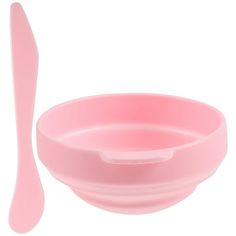 a pink bowl and spoon on a white background