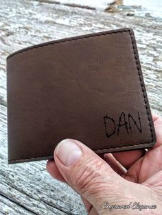 "This leatherette bifold wallet makes a great, classy gift for any occasion! Perfect for a dad or a husband! It's 3.5\"x4.35\" when closed, and is roughly 8.5\" long when open. For more info on leatherette synthetic leather, please read the paragraph a few lines down! If you have a special idea for a wallet, please message us! We can let you know what is possible! These wallets are vegan! We strive to ship orders within 24 hours! This item is customized using a laser engraver, which passes over Engraved Wallet, Husband Anniversary, Custom Wallet, Leather Bifold Wallet, Wallet Gifts, Leather Gifts, Personalized Leather, Custom Engraving, Vegan Leather