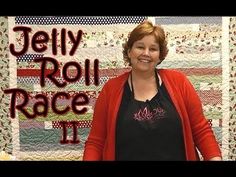 a woman standing in front of a quilt with the words jelly roll race ii on it