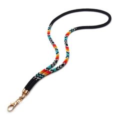 a multicolored dog leash with gold hardware