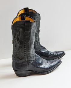 Used - Vintage - StingRay - 10.5 US - 13.5 Shaft.  These Black Stingray Boots are luxurious from top to toe. A soft black ranch hand leather compliments the sparkly black stingray leather accents on the vamp, pull straps, and collar of the boot. Every pair of Stallion Boots is handmade in El Paso, Texas. Each pair is delicately made with the utmost attention to detail from the painted soles to the handwritten size inside. Expertly hand crafted in El Paso, Texas, these boots have an elevated look Black Patent Leather Boots With Snip Toe, Black Patent Leather Snip Toe Boots, Black Goodyear Welted Boots For Galas, Fitted Snip Toe Boots For Galas, Ranch Hand, Mens Cowboy, Harness Boots, Leather Accents, Cowboy Western