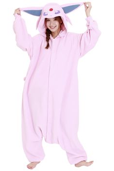 a woman in a pink bunny costume is holding her head up and smiling at the camera