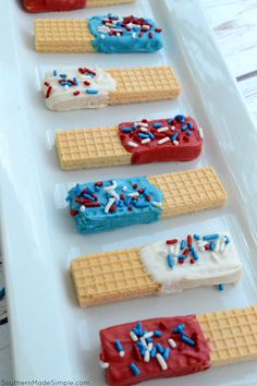 red, white and blue waffles are arranged in rows on a platter