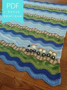 a crocheted rug with a train on it