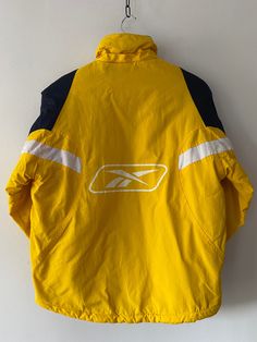 Vintage Yellow Winter REEBOK Puffer Jacket, unisex size kids 14-16 years, XS- S women Size:  XS-S women * PRODUCT SIZES: * - height                                   64cm  /  25.1 inch - sleeve                                   56 cm /  22.04 inch -shoulders                              48 cm   /  18.8 inch -armpit to armpit                   56 cm   /  22.04 inch Very good vintage condition. PLEASE PROVIDE YOUR PHONE NUMBER FOR FAST SHIPPING  ✈️        FAST SHIPPING with DHL EXPRESS! ☎️+ 💌 Provide phone no and email for DHL courier to have a smooth shipping. We deliver worldwide with DHL Express. ▪️ European countries         1-2 days ▪️ Canada/US/Japan/etc.    3-5 days  🟥  Returns & Exchange Policy We accept returns only after you receive the parcel and just in the case the item is not Sporty Windbreaker For Cold Weather, 90s Style Yellow Windbreaker For Streetwear, 90s Yellow Windbreaker For Winter, Yellow 90s Windbreaker For Winter, 90s Sports Outerwear With Pockets, 90s Style Sports Outerwear With Pockets, Functional Yellow Outerwear For Winter, Functional Yellow Winter Outerwear, 90s Style Yellow Winter Outerwear