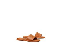 Tory Burch Double T Sport Slide - Women's Shoes : Aged Camello/Gold : Slip right into style and comfort with Tory Burch Double T Sport Slides! Upper, lining, and insole made of leather material. Slip-on construction. Iconic Tory Burch double T logo on vamp. Open snip-toe silhouette. Man-made outsole. Imported. Measurements: Weight: 7 oz Product measurements were taken using size 9, width M. Please note that measurements may vary by size. Weight of footwear is based on a single item, not a pair. Classic Tan Sandals With Leather Lining, Classic Tan Sandals With Leather Sole, Classic Tan Slip-on Sandals, Classic Tan Leather Sandals, Casual Tan Sandals With Leather Sole, Casual Tan Sandals With Leather Lining, Tan Leather Casual Sandals, T Logo, Slides Women